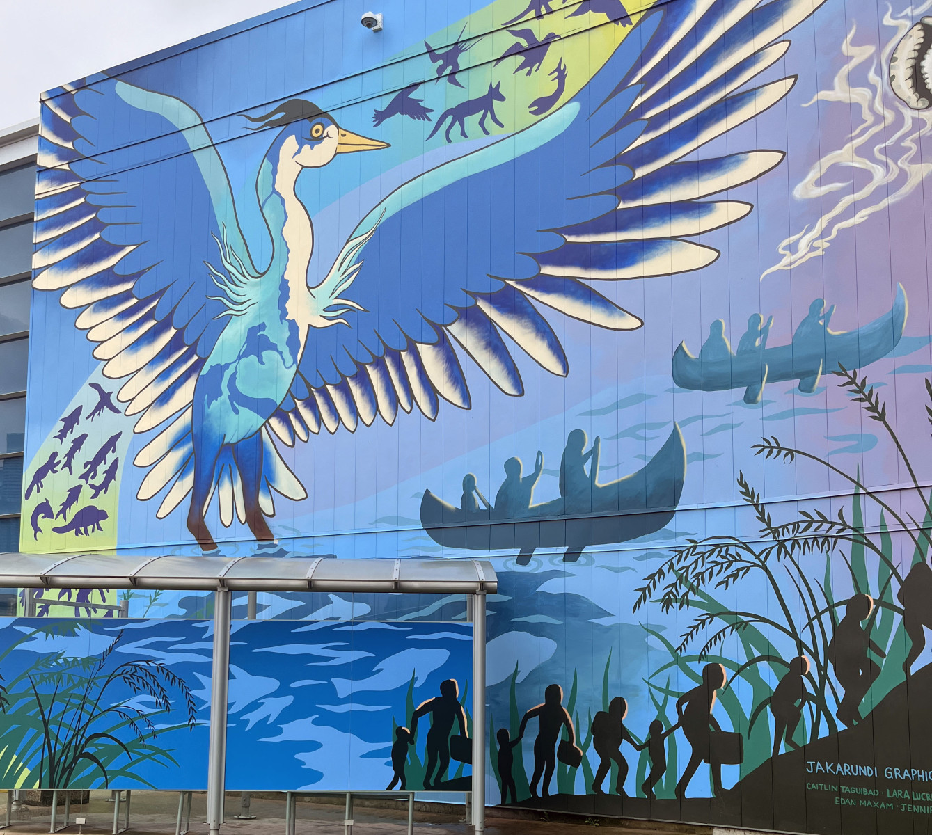 Jakarundi mural depicting a blue bird above Toronto’s waterfront.