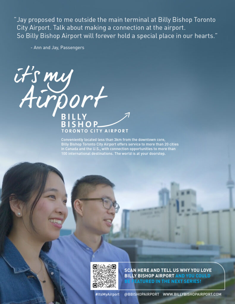 It’s My Airport campaign featuring two passengers overlooking the terminal.