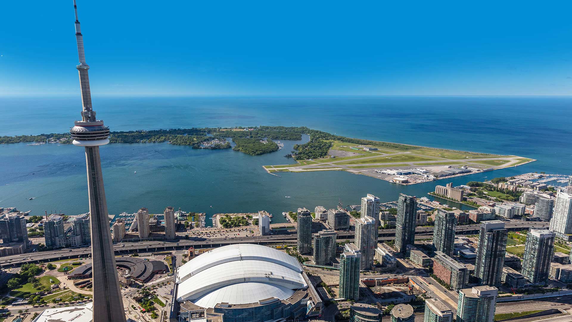 Aerial view of the Billy Bishop Toronto City Airport with Downtown Toronto in the foreground