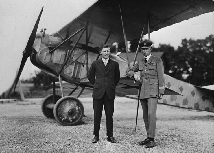 Billy Bishop standing infront of fighter plane