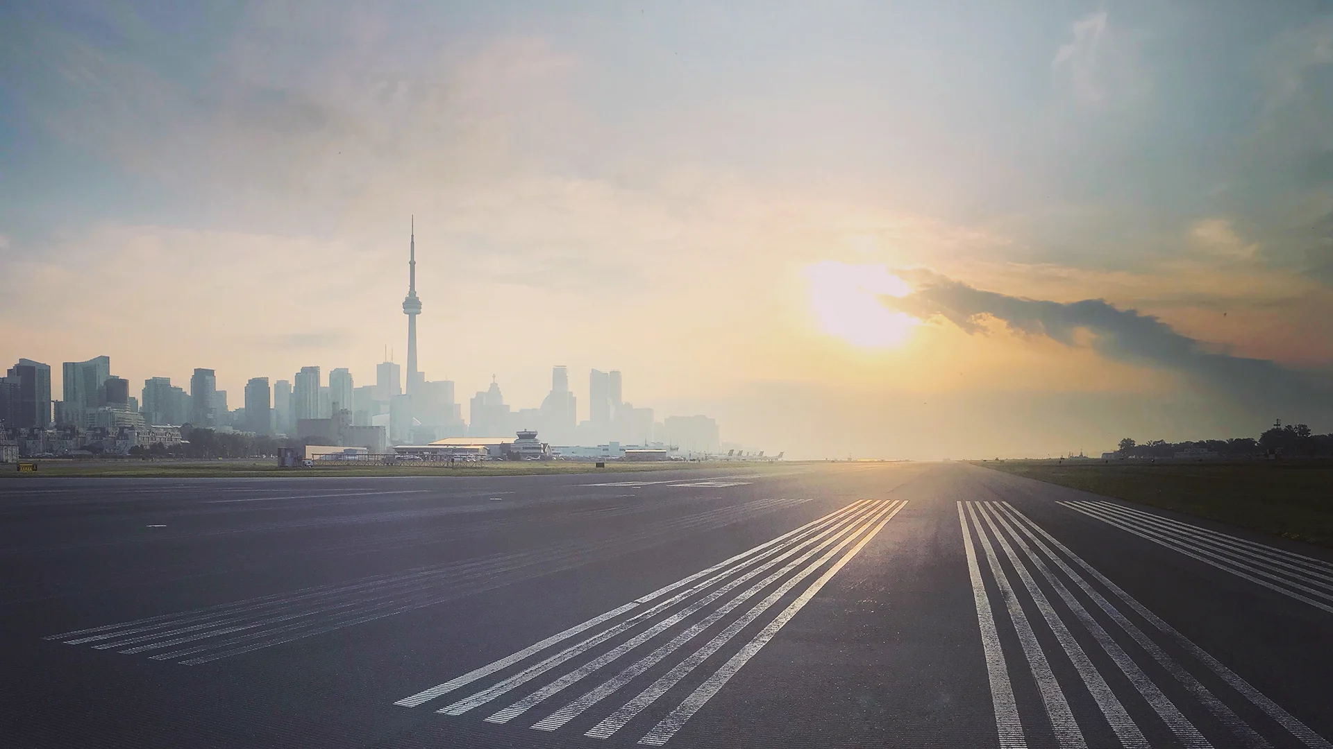 Airport runway with the city of Toronto in the background