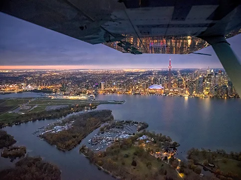 Aerial photo of the airport and downtown Toronto at night