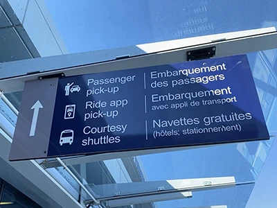 Sign at the airport for passenger pick-up, ride app pick-up and coutesy shuttles