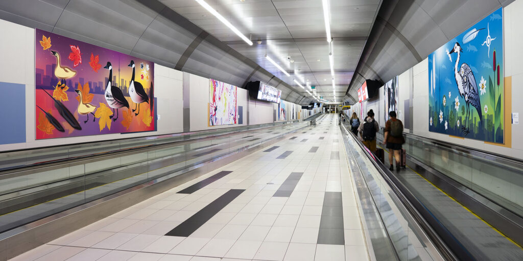 Colourful Perspectives artworks line the airport pedestrian tunnel.