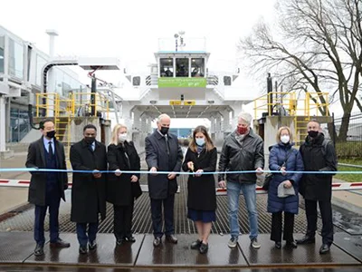 Ribbon cutting in front of the Marilyn Bell ferry.